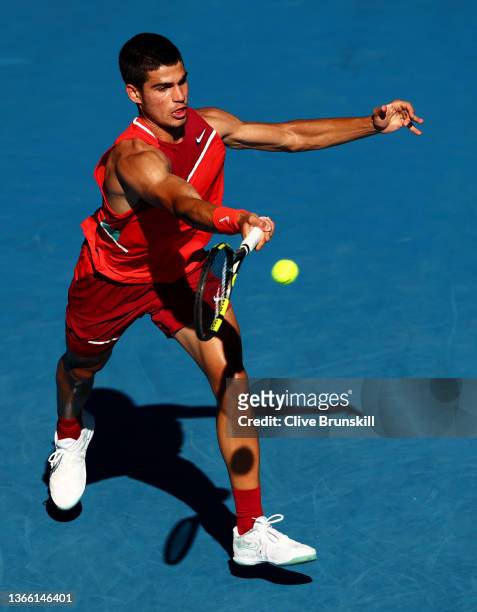 Carlos Alcaraz of Spain plays a forehand in his third round singles match against Matteo Berrettini of Italy during day five of the 2022 Australian...