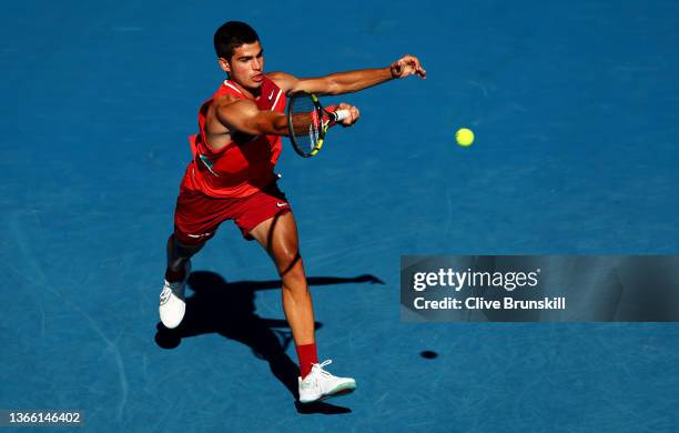 Carlos Alcaraz of Spain plays a forehand in his third round singles match against Matteo Berrettini of Italy during day five of the 2022 Australian...