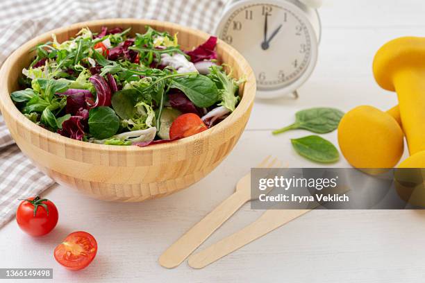 healthy food and diet concept. - salad bowl stock-fotos und bilder