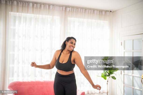 dancing alone always makes me happy - fat woman dancing stock pictures, royalty-free photos & images