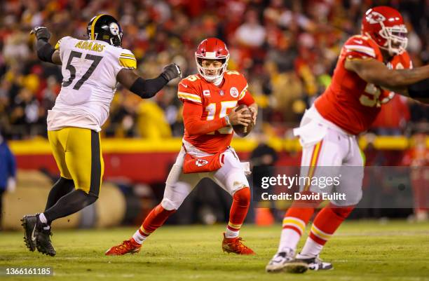 Patrick Mahomes of the Kansas City Chiefs tries to elude Montravius Adams of the Pittsburgh Steelers during the third quarter of the AFC Wild Card...