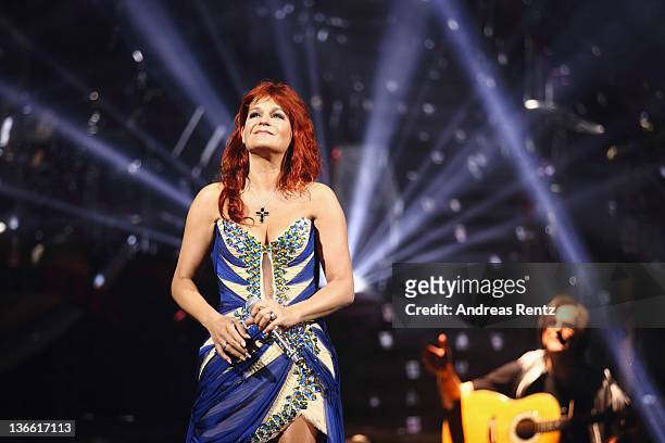 Singer Andrea Berg performs onstage during the 'Abenteuertour' 2012 premiere at Hanns-Martin-Schleyer-Halle on January 6, 2012 in Stuttgart, Germany.