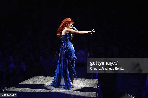 Singer Andrea Berg performs onstage during the 'Abenteuertour' 2012 premiere at Hanns-Martin-Schleyer-Halle on January 6, 2012 in Stuttgart, Germany.