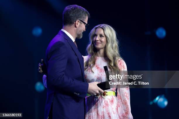 Amy Earnhardt officially inducts her husband, Dale Earnhardt Jr. Into the NASCAR Hall of Fame during the 2021 NASCAR Hall of Fame Induction ceremony...