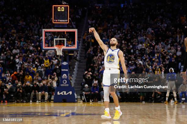 Stephen Curry of the Golden State Warriors shoots the game-winning shot as time expires to defeat the Houston Rockets at Chase Center on January 21,...