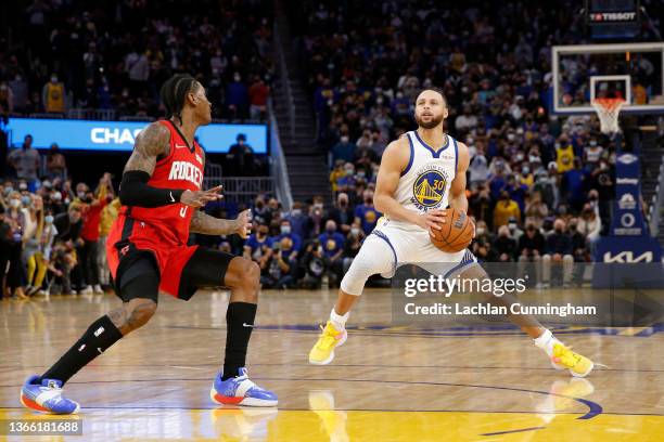 Stephen Curry of the Golden State Warriors steps back to shoot the game-winning shot as time expires to defeat the Houston Rockets at Chase Center on...