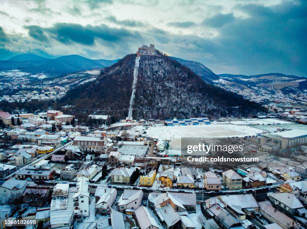 aerial view of streets and houses covered with snow in winter in deva, romania - transylvania stock pictures, royalty-free photos & images