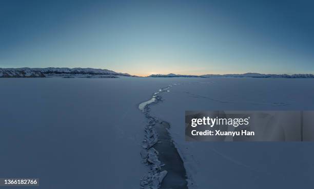 the natural landscape of frozen lake at dusk - ice sheet stock pictures, royalty-free photos & images