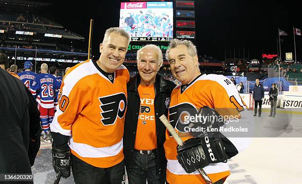 Jimmy Watson Chairman Ed Snider and Joe Watson of the Philadelphia Flyers pose for a photo after defeating the New York Rangers 3-1 following the...
