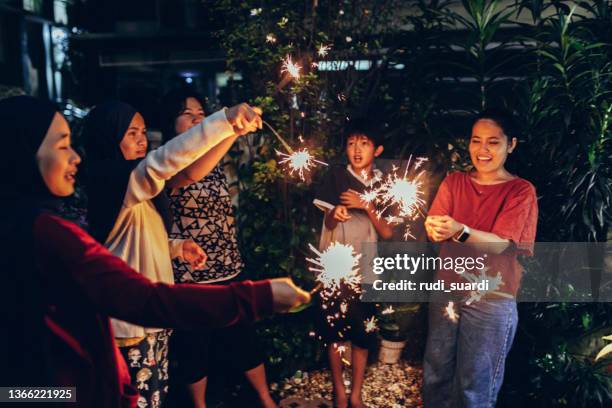 family new year's eve party. - multicultural gala an evening of many cultures stockfoto's en -beelden