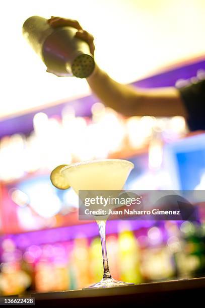 Waiter prepares a cocktail at "Museo Chicote" on January 6, 2012 in Madrid, Spain. Opened by Perico Chicote in 1931, the "Museo Chicote" is one of...