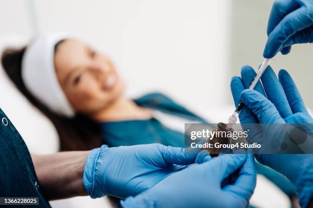 facial aesthetics surgery treatment - platelet rich plasma stock pictures, royalty-free photos & images