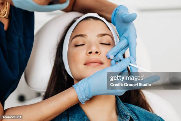 facial aesthetics surgery treatment - gezichtsbehandeling stockfoto's en -beelden