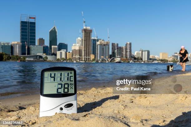 In this photo illustration a thermometer is seen on the banks of the Swan River on January 22, 2022 in Perth, Australia. Western Australia continues...