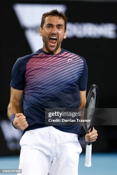 Marin Cilic of Croatia celebrates match point in his third round singles match against Andrey Rublev of Russia during day six of the 2022 Australian...