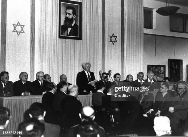 Picture dated 14 May 1948 shows Israeli Prime Minister David Ben Gourion flanked by members of his provisionnal gouvernement reading Israel's...