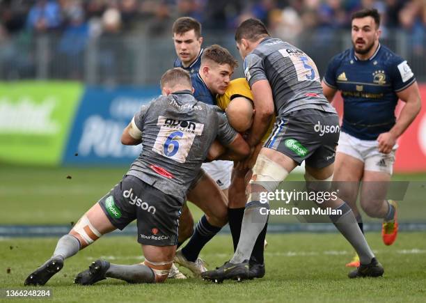 Referee, Andrea Piardi gets tangled in a tackle as Garry Ringrose of Leinster is tackled by Tom Ellis and Charlie Ewels of Bath during the Heineken...