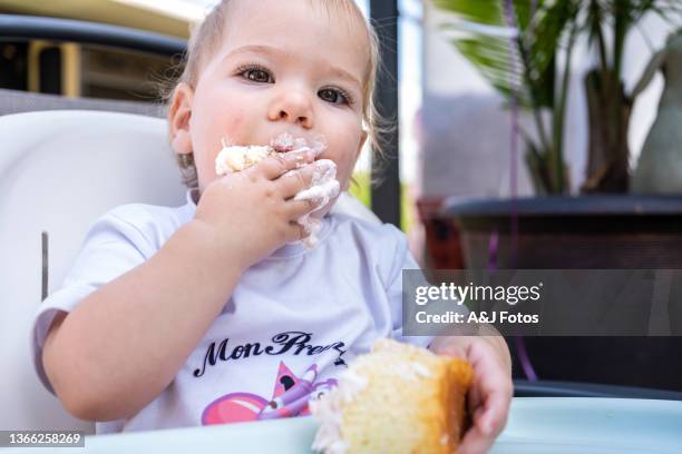 baby girl celebrating her first anniversary. - whipped food stock pictures, royalty-free photos & images