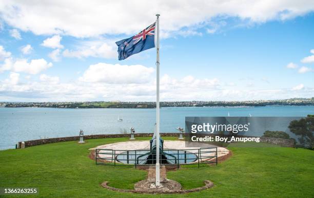 new zealand flag on the north head an old volcano in devonport of auckland, new zealand. - military bunker stock pictures, royalty-free photos & images