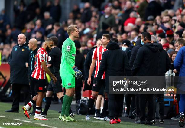 Players return to the dressing rooms after a drone stops play during the Premier League match between Brentford and Wolverhampton Wanderers at...