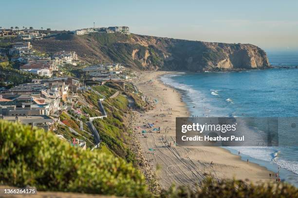 homes overlooking the ocean and beach with surfers in california - california seascape stock pictures, royalty-free photos & images