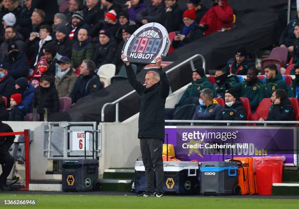 Fourth Official, Martin Atkinson holds up the board to announce 19 additional minutes due to a stoppage in play after a drone was flew over the...