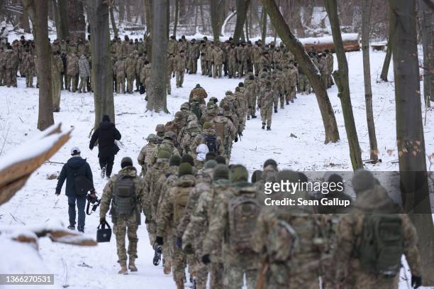 Civilian participants in a Kyiv Territorial Defence unit train on a Saturday in a forest on January 22, 2022 in Kyiv, Ukraine. Across Ukraine...