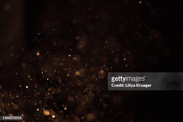 defocused lights and dust background. - star dust stock pictures, royalty-free photos & images