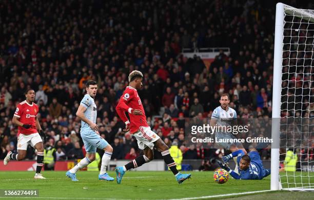 Marcus Rashford of Manchester United scores their team's first goal during the Premier League match between Manchester United and West Ham United at...