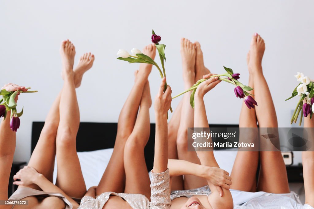 Women's party at home. Beautiful girls have fun, dress up in dresses, laugh, arrange gender parties