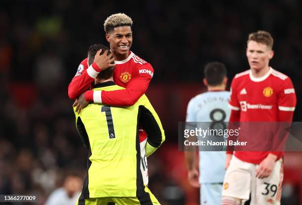 David De Gea embraces Marcus Rashford of Manchester United after their sides victory during the Premier League match between Manchester United and...