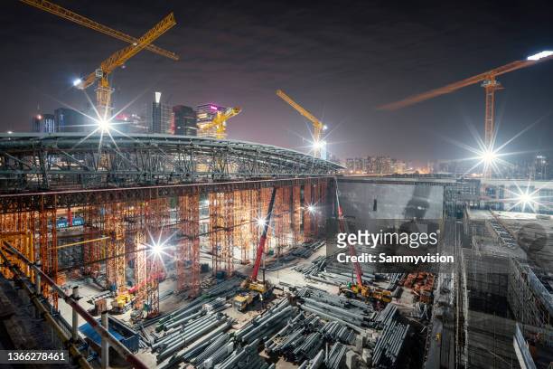new construction site in downtown district - construction crane asia stock pictures, royalty-free photos & images