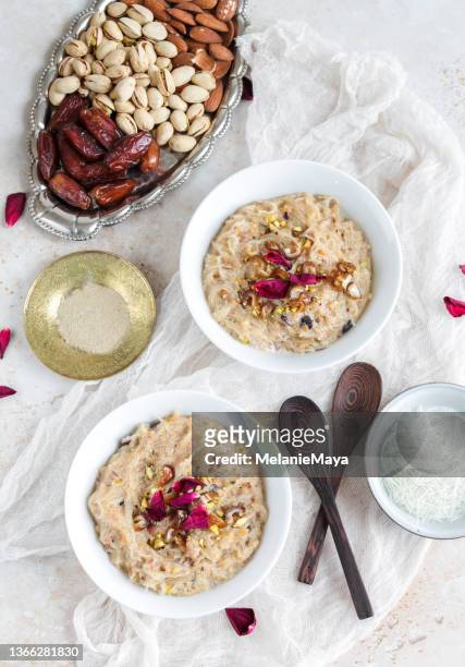 traditional sheer khurma dish for ramadan iftar with rose water, nuts and dates - sheer khurma stockfoto's en -beelden
