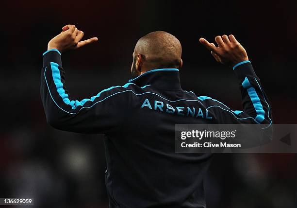 Thierry Henry of Arsenal warms up before the FA Cup Third Round match between Arsenal and Leeds United at the Emirates Stadium on January 9, 2012 in...