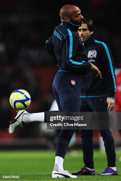 Thierry Henry of Arsenal warms up before the FA Cup Third Round match between Arsenal and Leeds United at the Emirates Stadium on January 9, 2012 in...