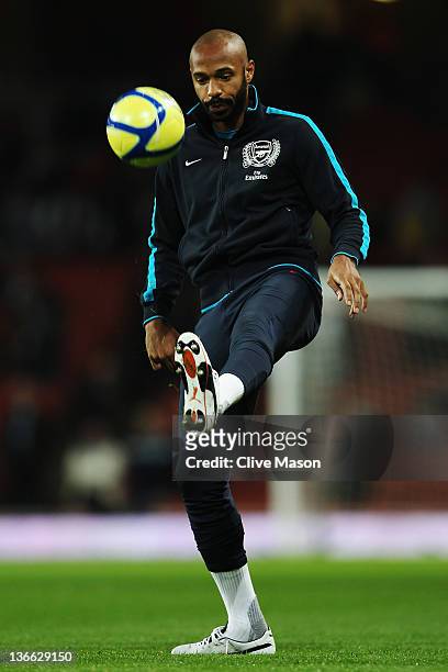 Thierry Henry of Arsenal warms up before the FA Cup Third Round match between Arsenal and Leeds United at the Emirates Stadium on January 9, 2012 in...