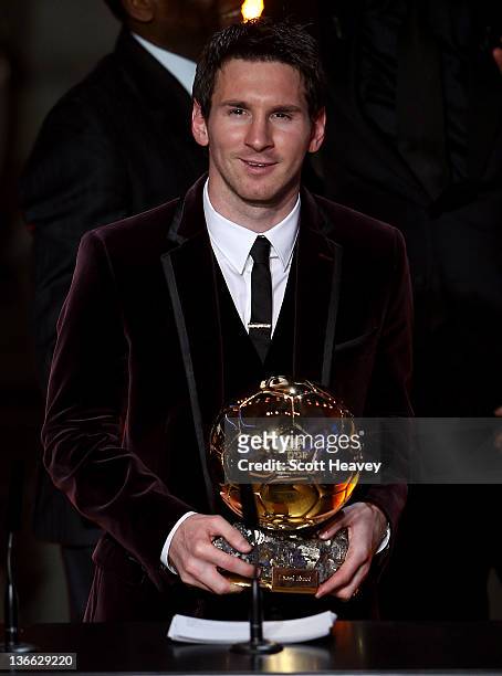 Lionel Messi of Barcelona receives the FIFA Ballon d'Or 2011 trophy on January 9, 2012 in Zurich, Switzerland.
