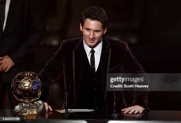 Lionel Messi of Barcelona receives the FIFA Ballon d'Or 2011 trophy on January 9, 2012 in Zurich, Switzerland.