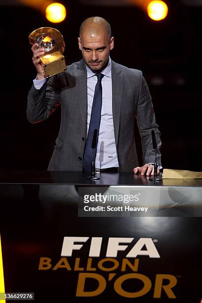 Barcelona Coach Pep Guardiola receives the FIFA World Coach of Men's Football 2011 trophy on January 9, 2012 in Zurich, Switzerland.