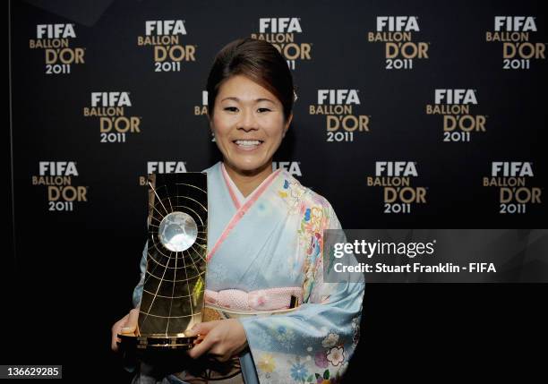 Homare Sawa of Japan poses with the trophy after winning the FIFA Women's World Player of the Year award at the FIFA Ballon d'Or Gala 2011 at the...