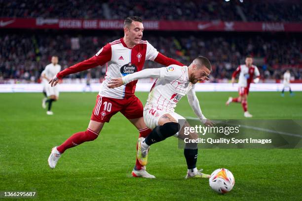 Papu Gomez of Sevilla FC competes for the ball with Iago Aspas of RC Celta de Vigo during the La Liga Santander match between Sevilla FC and RC Celta...