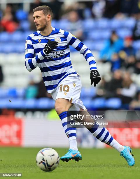 John Swift of Reading runs with the ball during the Sky Bet Championship match between Reading and Huddersfield Town at the Madejski Stadium on...
