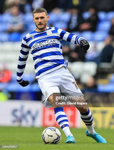 John Swift of Reading runs with the ball during the Sky Bet Championship match between Reading and Huddersfield Town at the Madejski Stadium on...