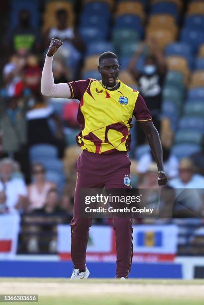 Jason Holder of West Indies celebrates the wicket of Moeen Ali of England during the T20 International Series First T20I match between West Indies...