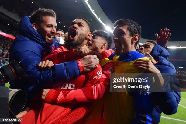 Matheus Cunha of Atletico Madrid celebrates with teammates after scoring their team's third goal during the LaLiga Santander match between Club...