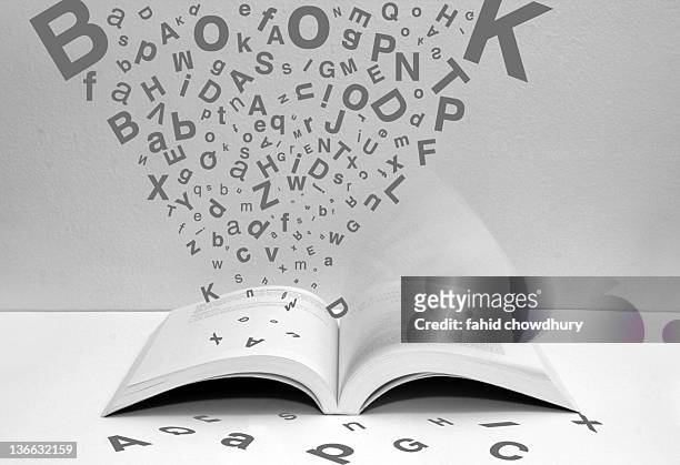 open book - flying letters stock pictures, royalty-free photos & images