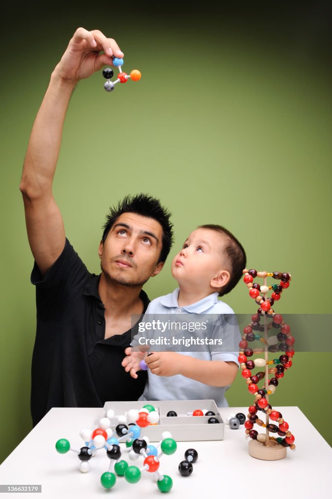 Father and son building molecular structures