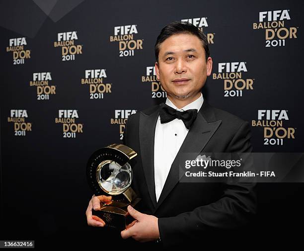 Norio Sasaki of Japan with his trophy after winning the FIFA World Coach of the Year for Women's Football award at the FIFA Ballon d'Or Gala 2011 at...