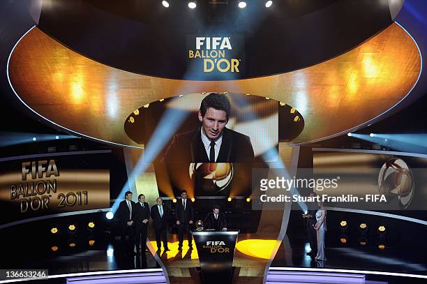 Lionel Messi of Argentina addresses the audience after winning his third consecutive FIFA Ballon d'Or title at the FIFA Ballon d'Or Gala 2011 at the...