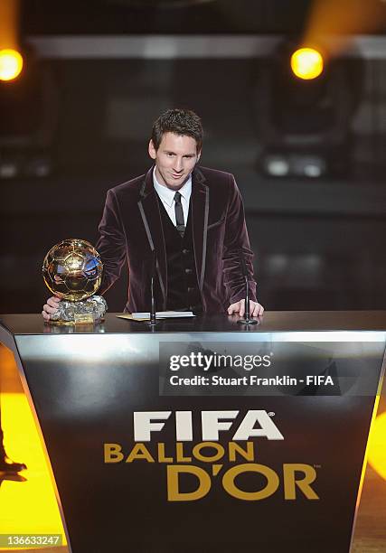 Lionel Messi of Argentina addresses the audience after winning his third consecutive FIFA Ballon d'Or title at the FIFA Ballon d'Or Gala 2011 at the...